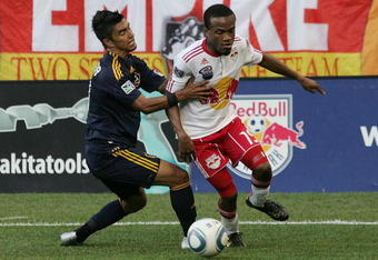 HARRISON, NJ - AUGUST 14: Dane Richards #19 of the New York Red Bulls and A.J. DeLaGarza #20 of the Los Angeles Galaxy battle for a loose ball during the game at Red Bull Arena on August 14, 2010 in Harrison, New Jersey. (Photo by Andy Marlin/Getty Images )
