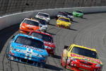 BROOKLYN, MI - AUGUST 15:  Elliott Sadler, driver of the #19 Henry Ford Museum: Racing in America Ford and Marcos Ambrose, driver of the #47 Little Debbie Toyota, leads a pack of cars during the NASCAR Sprint Cup Series CARFAX 400 at Michigan International Speedway on August 15, 2010 in Brooklyn, Michigan.  (Photo by Jonathan Daniel/Getty Images)
