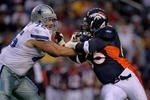 DENVER - AUGUST 16:  Tackle Marc Colombo #75 of the Dallas Cowboys tries to hold off the rush of Dewayne Robertson #63 of the Denver Broncos during preseason NFL action at Invesco Field at Mile High on August 16, 2008 in Denver, Colorado. The Broncos defeated the Cowboys 23-13.  (Photo by Doug Pensinger/Getty Images)