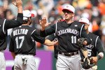 SAN FRANCISCO - MAY 31:  Brad Hawpe #11 of the Colorado Rockies celebrates after defeating the San Francisco Giants during an MLB game at AT&T Park on May 31, 2010 in San Francisco, California.  (Photo by Jed Jacobsohn/Getty Images)