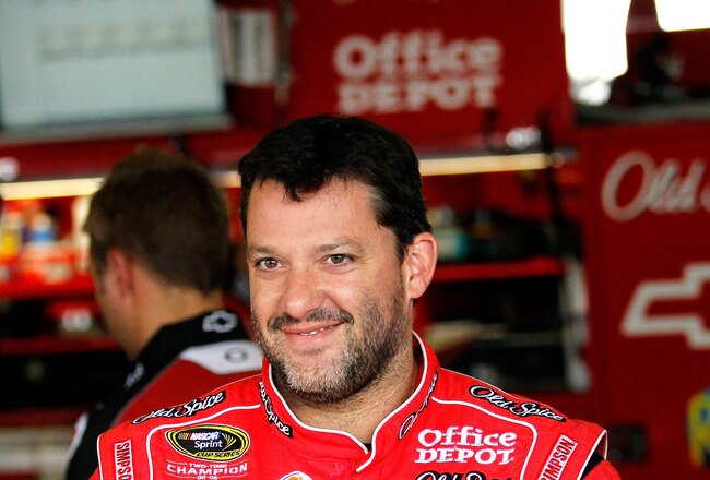 WATKINS GLEN, NY - AUGUST 06:  Tony Stewart, driver of the #14 Office Depot/Old Spice Chevrolet, looks on in the garage during practice for the NASCAR Heluva Good! Sour Cream Dips at The Glen on August 6, 2010 in Watkins Glen, New York.  (Photo by Kevin C. Cox/Getty Images)