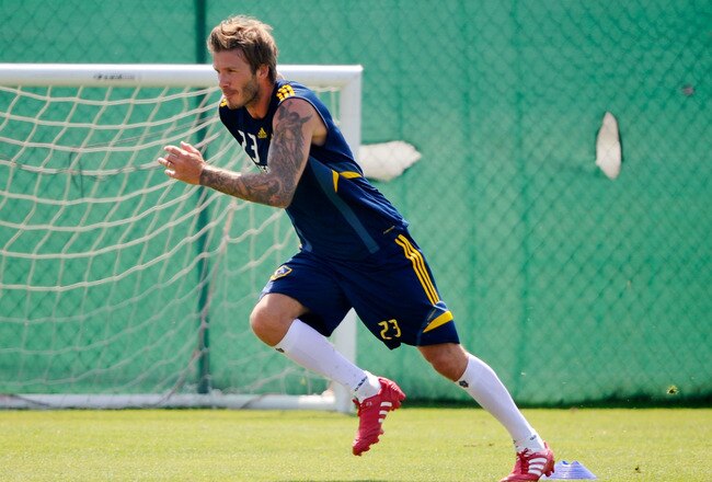CARSON, CA - AUGUST 11:  David Beckham (R) of the Los Angeles Galaxy warms up during a training session at The Home Depot Center on August 11, 2010 in Carson, California. Beckham tore his left Achilles' tendon last March while on loan to AC Milan.  (Photo by Kevork Djansezian/Getty Images)