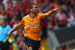 LIVERPOOL, ENGLAND - SEPTEMBER 26:  Geovanni (R) of Hull City celebrates scoring his team's first goal with team mate George Boateng during the Barclays Premier League match between Liverpool and Hull City at Anfield on September 26, 2009 in Liverpool, England.  (Photo by Clive Brunskill/Getty Images)