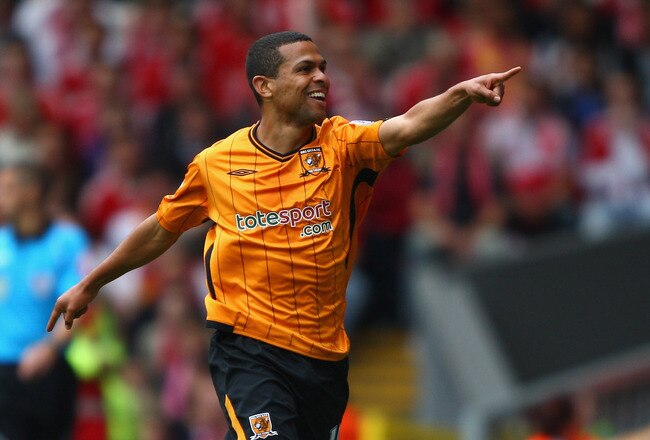 LIVERPOOL, ENGLAND - SEPTEMBER 26:  Geovanni (R) of Hull City celebrates scoring his team's first goal with team mate George Boateng during the Barclays Premier League match between Liverpool and Hull City at Anfield on September 26, 2009 in Liverpool, England.  (Photo by Clive Brunskill/Getty Images)