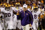 BATON ROUGE, LA - NOVEMBER 28:  Head coach Les Miles of the LSU Tigers takes the field before the game against the Arkansa Razorbacks at Tiger Stadium on November 28, 2009 in Baton Rouge, Louisiana.  The Tigers defeated the Razorbacks 33-30 in overtime.  (Photo by Chris Graythen/Getty Images)