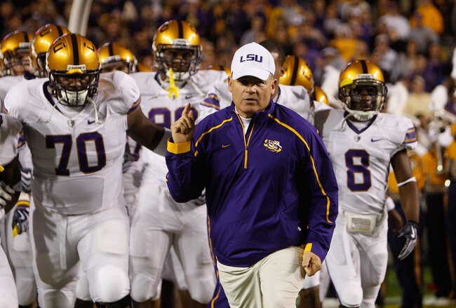 BATON ROUGE, LA - NOVEMBER 28:  Head coach Les Miles of the LSU Tigers takes the field before the game against the Arkansa Razorbacks at Tiger Stadium on November 28, 2009 in Baton Rouge, Louisiana.  The Tigers defeated the Razorbacks 33-30 in overtime.  (Photo by Chris Graythen/Getty Images)