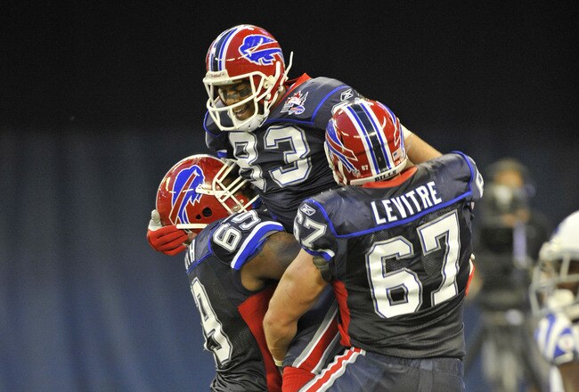 TORONTO - AUGUST 19:  Jamon Meredith # 69, Lee Evens #83 and Andy Levitre #67 of the Buffalo Bills celebrate a first half touchdown against the Indianapolis Colts during game action August 19, 2010 at the Rogers Centre in Toronto, Ontario, Canada. (Photo by Brad White/Getty Images)