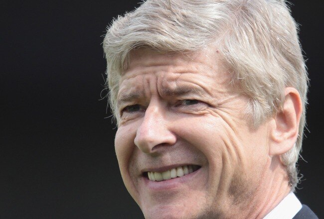 LONDON, ENGLAND - JULY 17:   Manager Arsene Wenger of Arsenal smiles during the pre-season friendly match between Barnet and Arsenal at Underhill on July 17, 2010 in London, England.  (Photo by Phil Cole/Getty Images)