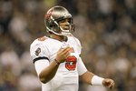 NEW ORLEANS - DECEMBER 27:  Quarterback Josh Freeman #5 of the Tampa Bay Buccaneers looks down the field during the game against the New Orleans Saints at the Louisiana Superdome on December 27, 2009 in New Orleans, Louisiana. (Photo by Jamie Squire/Getty Images)