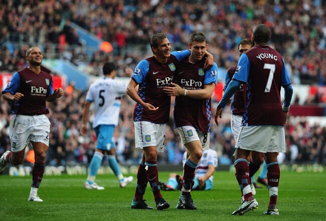 BIRMINGHAM, ENGLAND - AUGUST 14:  James Milner of Aston Villa celebrates his goal with Marc Albrighton during the Barclays Premier League match between Aston Villa and West Ham United at Villa Park on August 14, 2010 in Birmingham, England.  (Photo by Jamie McDonald/Getty Images)