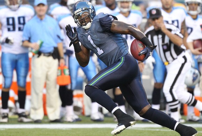 SEATTLE - AUGUST 14:  Wide receiver Mike Williams #1 of the Seattle Seahawks rushes for a touchdown pass play during the preseason game against the Tennessee Titans at Qwest Field on August 14, 2010 in Seattle, Washington. (Photo by Otto Greule Jr/Getty Images)