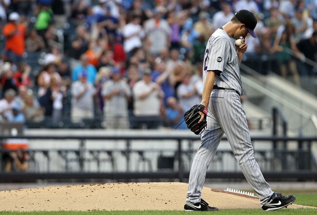NEW YORK - AUGUST 11:  Jeff Francis #26 of the Colorado Rockies walks past the mound after giving up a two run home run in the first inning against the New York Mets at Citi Field on August 11, 2010 in the Flushing neighborhood of the Queens borough of New York City.  (Photo by Nick Laham/Getty Images)
