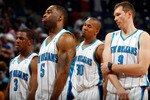 NEW ORLEANS - MARCH 31:  Members of the New Orleans Hornets react to losing to the Washington Wizards 96-91 at New Orleans Arena on March 31, 2010 in New Orleans, Louisiana.  NOTE TO USER: User expressly acknowledges and agrees that, by downloading and/or using this Photograph, User is consenting to the terms and conditions of the Getty Images License Agreement.  (Photo by Chris Graythen/Getty Images)