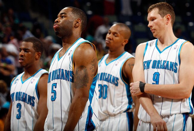 NEW ORLEANS - MARCH 31:  Members of the New Orleans Hornets react to losing to the Washington Wizards 96-91 at New Orleans Arena on March 31, 2010 in New Orleans, Louisiana.  NOTE TO USER: User expressly acknowledges and agrees that, by downloading and/or using this Photograph, User is consenting to the terms and conditions of the Getty Images License Agreement.  (Photo by Chris Graythen/Getty Images)