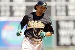 OAKLAND, CA - AUGUST 18:  Coco Crisp #4 of the Oakland Athletics rounds the bases after he hit a solo home run in the seventh inning of their game against the Toronto Blue Jays at the Oakland-Alameda County Coliseum on August 18, 2010 in Oakland, California.  (Photo by Ezra Shaw/Getty Images)