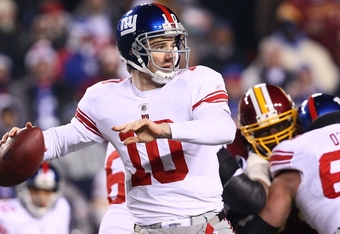 LANDOVER, MD - DECEMBER 21:  Quarterback Eli Manning #10 of the New York Giants drops back to pass against the Washington Redskins at FedEx Field on December 21, 2009 in Landover, Maryland. (Photo by Win McNamee/Getty Images)