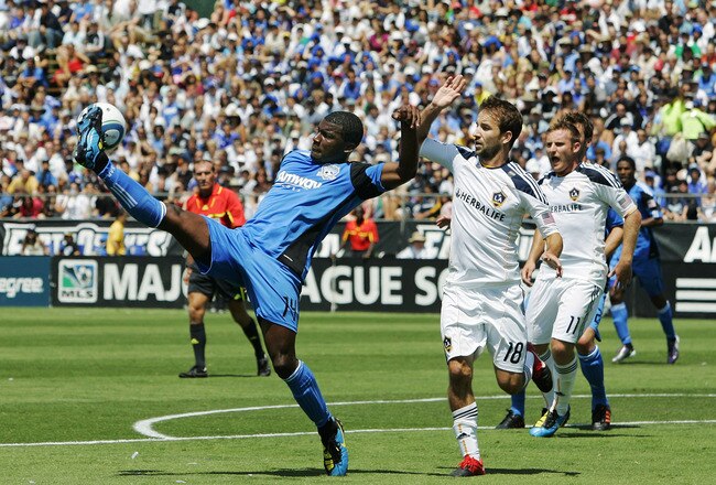 SANTA CLARA, CA - AUGUST 21:  Brandon McDonald #14 of the San Jose Earthquakes tries to knock down the ball in front of the goal against Mike Magee #18 of the Los Angeles Galaxy on August 21, 2010 at Buck Shaw Stadium in Santa Clara, California.  (Photo by Brian Bahr/Getty Images)
