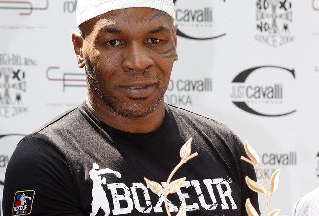 MILAN, ITALY - JULY 09:  Mike Tyson poses with the 'Ghirlande D'Honneur' award at Just Cavalli Cafe on July 9, 2010 in Milan, Italy.  (Photo by Vittorio Zunino Celotto/Getty Images)