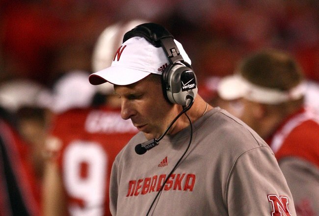 SAN DIEGO - DECEMBER 30:  Head Coach Bo Pelini of the University of Nebraska looks at his play list during the Pacific Life Holiday Bowl against University of Arizona Wildcats on December 30, 2009 at Qualcomm Stadium in San Diego, California. The Cornhuskers defeated the Wildcats 33-0. (Photo By Donald Miralle/Getty Images)