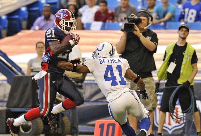 TORONTO, CANADA - AUGUST 19: C.J. Spiller #21 of the Buffalo Bills avoids the tackle of Antoine Bethea #41 of the Indianapolis Colts during game action August 19, 2010 at the Rogers Centre in Toronto, Ontario, Canada. (Photo by Brad White/Getty Images)