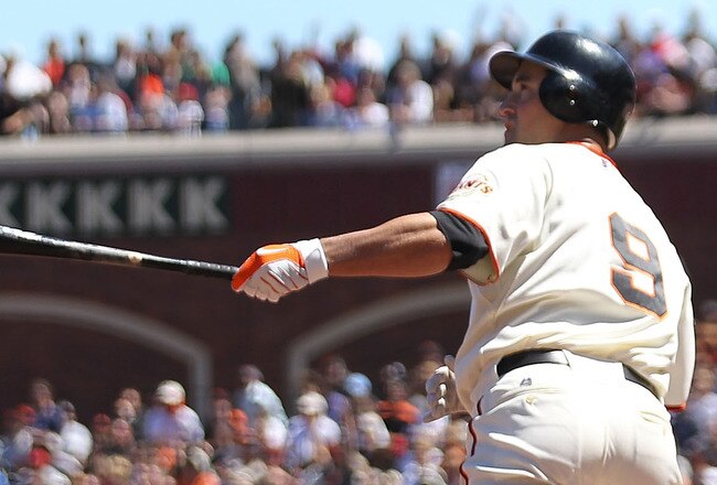 SAN FRANCISCO - AUGUST 12:  Pat Burrell #9 of the San Francisco Giants hits a grand slam against the Chicago Cubs in the fifth inning during an MLB game at AT&T Park on August 12, 2010 in San Francisco, California.  (Photo by Jed Jacobsohn/Getty Images)