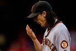 ST. LOUIS - AUGUST 21: Starter Tim Lincecum #55 of the San Francisco Giants reacts to giving up a home run against the St. Louis Cardinals at Busch Stadium on August 21, 2010 in St. Louis, Missouri.  (Photo by Dilip Vishwanat/Getty Images)