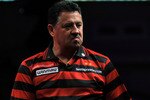 LONDON, ENGLAND - DECEMBER 18:  Dennis Priestley celebrates winning a set against Kevin McDine during the 2010 Ladbrokes.com World Darts Championship Round One at Alexandra Palace on December 18, 2009 in London, England.  (Photo by Christopher Lee/Getty Images)