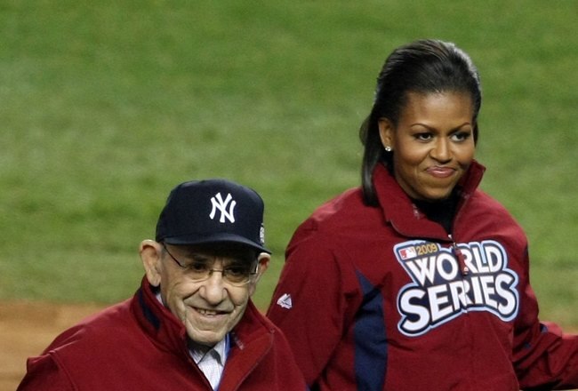 NEW YORK - OCTOBER 28:  (L-R) Dr. Jill Biden, wife of Vice President Joe Biden, New York Yankees legend and Baseball Hall of Famer Yogi Berra, First lady Michelle Obama and Iraq veteran Tony Odierno walk off the field during Game One of the 2009 MLB World Series between the New York Yankees and the Philadelphia Phillies at Yankee Stadium on October 28, 2009 in the Bronx borough of New York City.  (Photo by Nick Laham/Getty Images)