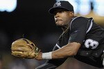 LOS ANGELES, CA - AUGUST 17:   Eric Young #3 of the Colorado Rockies attempts a throw to first on an infield hit by Matt Kemp #27 of the Los Angeles Dodgers during eighth inning at Dodger Stadium on August 17, 2010 in Los Angeles, California.  (Photo by Harry How/Getty Images)