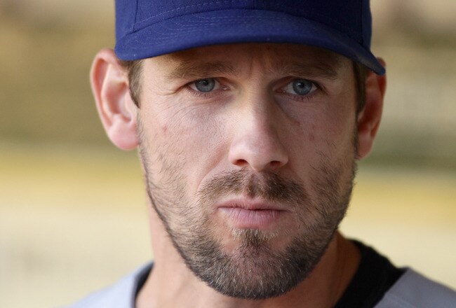 OAKLAND, CA - AUGUST 06:  Cliff Lee #33 of the Texas Rangers stands in the dugout before their game against the Oakland Athletics at the Oakland-Alameda County Coliseum on August 6, 2010 in Oakland, California.  (Photo by Ezra Shaw/Getty Images)