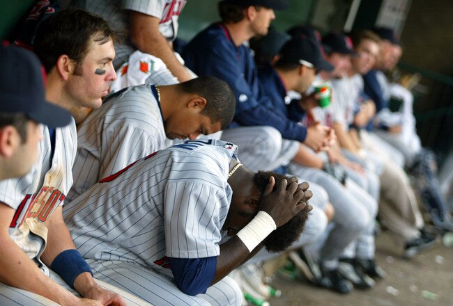 ANAHEIM, CA - OCTOBER 13: Cristian Guzman #15 of the Minnesota Twins sits in the dugout after their loss to the Anaheim Angels in Game five of the American League Championship Series on October 13, 2002 at Edison International Field in Anaheim, California.  (Photo by Donald Miralle/Getty Images)