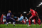 MANCHESTER, ENGLAND - AUGUST 23:  Carlos Tevez of Manchester City scores the second goal  during the Barclays Premier League match between Manchester City and Liverpool at City of Manchester Stadium on August 23, 2010 in Manchester, England.  (Photo by Laurence Griffiths/Getty Images)