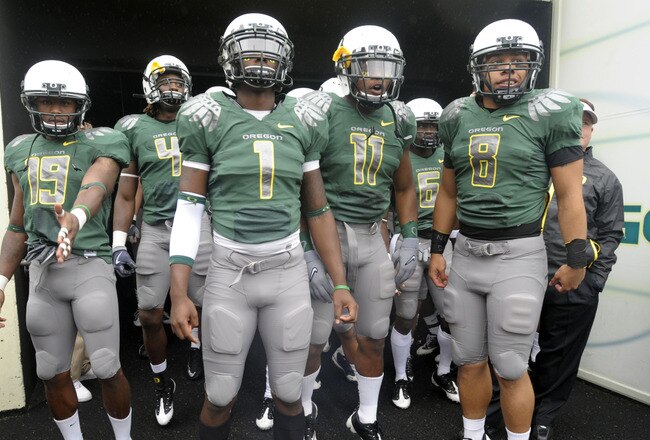 EUGENE, OR - SEPTEMBER 19: Jamere Holland #19, Darron Thomas #1, Eddie Pleasant #11 and Jeremiah Masoli #8 of the Oregon Ducks wait in the tunnel to be introduced before the start of the game against the Utah Utes at Autzen Stadium on September 19, 2009 in Eugene, Oregon. Oregon won the game 31-24. (Photo by Steve Dykes/Getty Images)