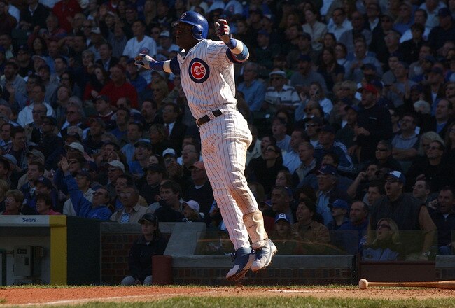 CHICAGO - SEPTEMBER 30:  Sammy Sosa #21 of the Chicago Cubs hops after hitting a solo home run in the sixth inning against the Cincinnati Reds during a game on September 30, 2004 at Wrigley Field in Chicago, Illinois. (Photo by Jonathan Daniel/Getty Images)