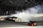 BRISTOL, TN - AUGUST 20:  Brad Keselowski, driver of the #22 Discount Tire Dodge, spins out after an incident with Kyle Busch, driver of the #18 Z-Line Designs Toyota, during the NASCAR Nationwide Series Food City 250 at Bristol Motor Speedway on August 20, 2010 in Bristol, Tennessee.  (Photo by Jared C. Tilton/Getty Images for NASCAR)