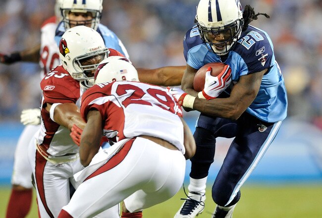 NASHVILLE, TN - AUGUST 23:  Chris Johnson #28 of the Tennessee Titans avoids defenders Clark Haggans #53 and Dominique Rogers-Cromartie #29 of te Arizona Cardinals during the first half of a preseason game at LP Field on August 23, 2010 in Nashville, Tennessee.  (Photo by Grant Halverson/Getty Images)
