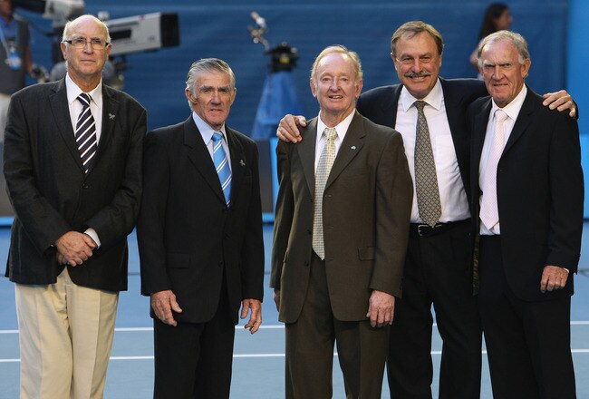 MELBOURNE, AUSTRALIA - FEBRUARY 01:  Rod Laver (C) poses with (L-R) Andres Gimeno, Ken Rosewall, John Newcombe and Tony Roche on Rod Laver Arena during day fourteen of the 2009 Australian Open at Melbourne Park on  February 1, 2009 in Melbourne, Australia. Laver beat Gimeno, Rosewall,  Newcombe and Roche respectively in the finals of the Australian Open, the French Open, Wimbledon and the US Open in 1969 to complete his second grand slam.  (Photo by Mark Dadswell/Getty Images)
