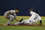 SAN JUAN, PUERTO RICO - JUNE 30:  Alex Cora #13 of the New York Mets is late with the tag as Hanley Ramirez #2 of the Florida Marlins steals second base during their game at Hiram Bithorn Stadium on June 30, 2010 in San Juan, Puerto Rico.  (Photo by Al Bello/Getty Images)