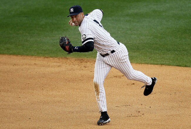 NEW YORK - AUGUST 22:  Derek Jeter #2 of the New York Yankees fields the ball for an out against the Seattle Mariners on August 22, 2010 at Yankee Stadium in the Bronx borough of New York City.  (Photo by Jim McIsaac/Getty Images)