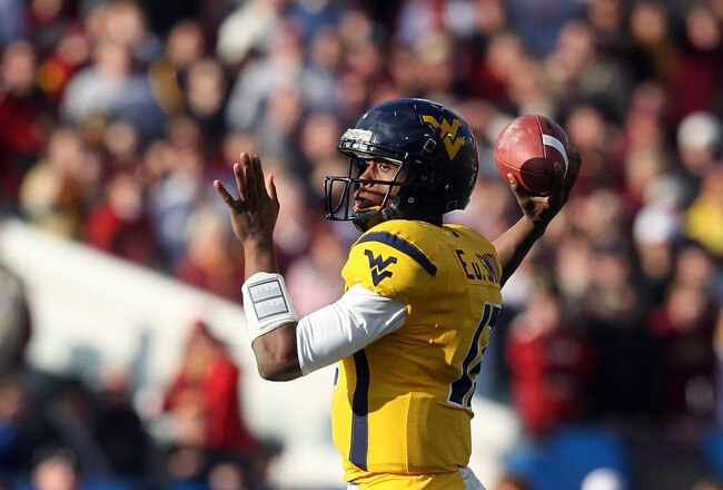 JACKSONVILLE, FL - JANUARY 01: Quarterback Geno Smith #12 of the West Virginia Mountaineers throws a pass against the Florida State Seminoles during the Konica Minolta Gator Bowl on January 1, 2010 at Jacksonville Municipal Stadium in Jacksonville, Florida. Florida State defeated West Virginia 33-21 in Bobby Bowden's last game as a head coach for the Seminoles.  (Photo by Doug Benc/Getty Images)