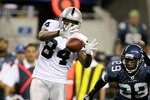 SEATTLE - SEPTEMBER 03:  Wide receiver Javon Walker #84 of the Oakland Raiders makes a catch against Marquis Floyd #29 of the Seattle Seahawks on September 3, 2009 at Qwest Field in Seattle, Washington. (Photo by Otto Greule Jr/Getty Images)
