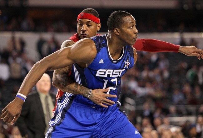 ARLINGTON, TX - FEBRUARY 14:  Dwight Howard #12 of the Eastern Confernce plays defense against Carmelo Anthony #15 of the Western Conference during the NBA All-Star Game, part of 2010 NBA All-Star Weekend at Cowboys Stadium on February 14, 2010 in Arlington, Texas. The Eastern Conference defeated the Western Conference 141-139 in regulation. NOTE TO USER: User expressly acknowledges and agrees that, by downloading and or using this photograph, User is consenting to the terms and conditions of the Getty Images License Agreement.  (Photo by Jed Jacobsohn/Getty Images)