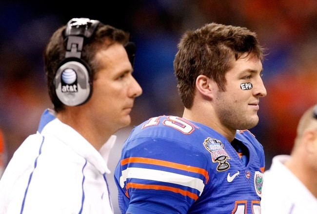 NEW ORLEANS - JANUARY 01:  (L-R) Head Coach Urban Meyer Tim Tebow #15 and Offensive coordinator and interim head coach Steve Addazio of the Florida Gators watches from the sidelines during the Allstate Sugar Bowl against the Cincinnati Bearcats at the Louisana Superdome on January 1, 2010 in New Orleans, Louisiana.  (Photo by Kevin C. Cox/Getty Images)