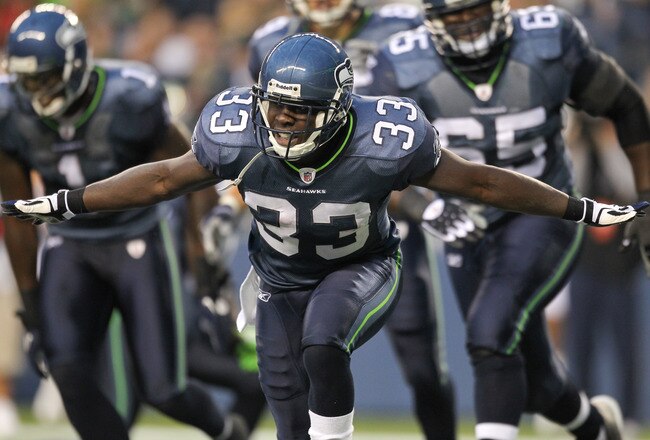 SEATTLE - AUGUST 21:  Running back Leon Washington #33 of the Seattle Seahawks celebrates after scoring a touchdown during the preseason game against the Green Bay Packers at Qwest Field on August 21, 2010 in Seattle, Washington. (Photo by Otto Greule Jr/Getty Images)