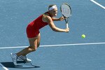 CARLSBAD, CA - AUGUST 04:  Melanie Oudin goes to the net against Samantha Stosur of Australia during their match in the Mercury Insurance Open at La Costa Resort and Spa on August 4, 2010 in Carlsbad, California.  (Photo by Stephen Dunn/Getty Images)