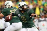 PASADENA, CA - JANUARY 01:  Quarterback Jeremiah Masoli #8 of the Oregon Ducks attempts a pass against the Ohio State Buckeyes at the 96th Rose Bowl game on January 1, 2010 in Pasadena, California.  (Photo by Stephen Dunn/Getty Images)