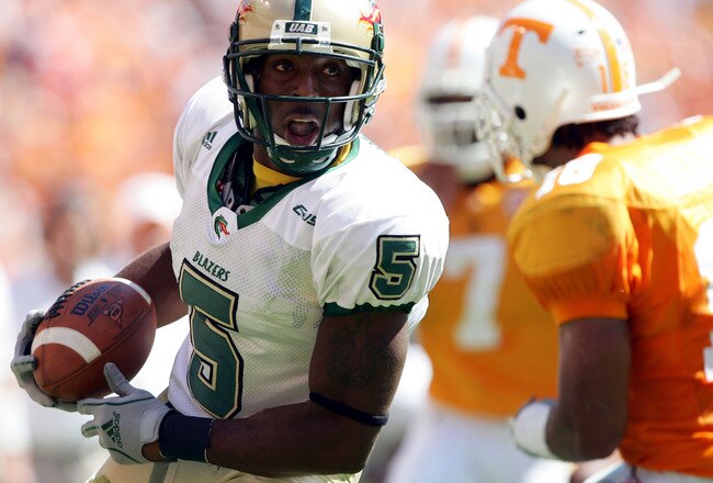 KNOXVILLE, TN - SEPTEMBER 3:  Jhun Cook #5 of UAB carries the ball as Jason Allen #18 of Tennessee closes in on September 3, 2005  at Neyland Stadium in Knoxville, Tennessee. The Volunteers defeated UAB 17-10.  (Photo by Elsa/Getty Images)