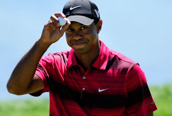 KOHLER, WI - AUGUST 15:  Tiger Woods waves to the gallery after a birdie putt on the seventh green during the final round of the 92nd PGA Championship on the Straits Course at Whistling Straits on August 15, 2010 in Kohler, Wisconsin.  (Photo by Stuart Franklin/Getty Images)