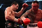 HERNING, DENMARK - APRIL 24:  Mikkel Kessler of Denmark (R) lands a right cross on Carl Froch of England during their Super Six WBC Super Middleweight title fight on April 24, 2010 at MCH  Messecenter Arena in Herning, Denmark.  (Photo by John Gichigi/Getty Images)