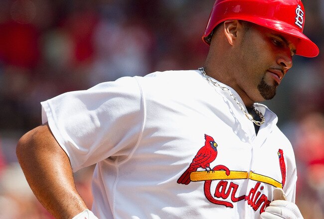 ST. LOUIS - AUGUST 1: Albert Pujols #5 of the St. Louis Cardinals rounds the bases after hitting a two-run home run against the Pittsburgh Pirates at Busch Stadium on August 1, 2010 in St. Louis, Missouri.  The Cardinals beat the Pirates 9-1.  (Photo by Dilip Vishwanat/Getty Images)